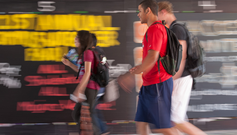 students walking through the underpass