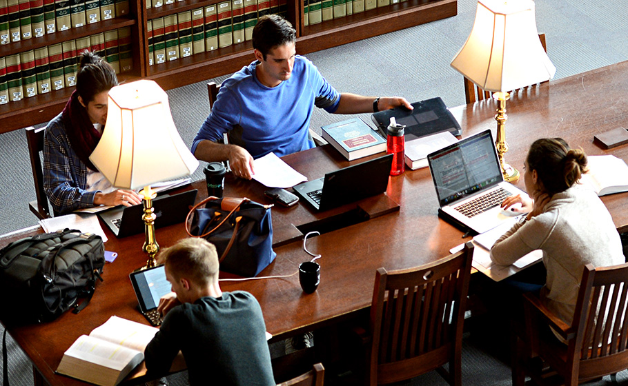 students sitting at table in Law library