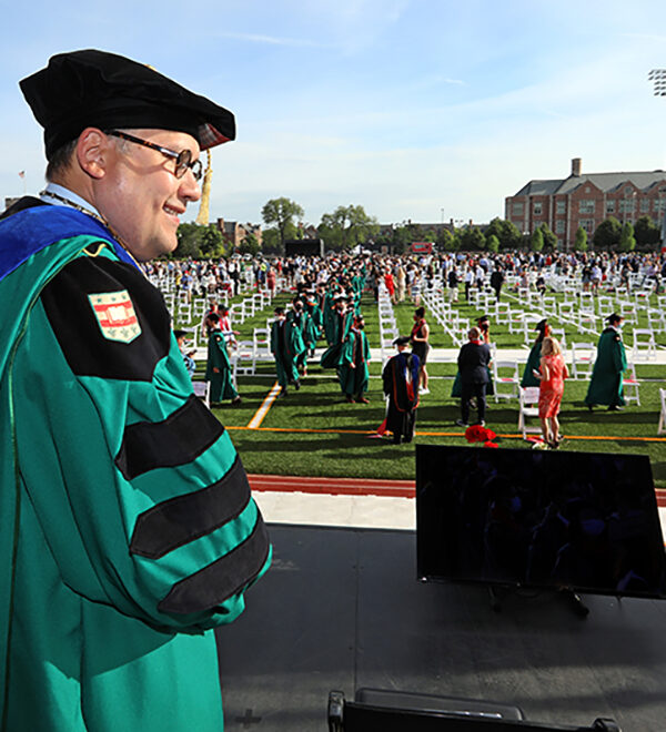 Chancellor Martin on stage at 2021 May Commencement on Francis Field